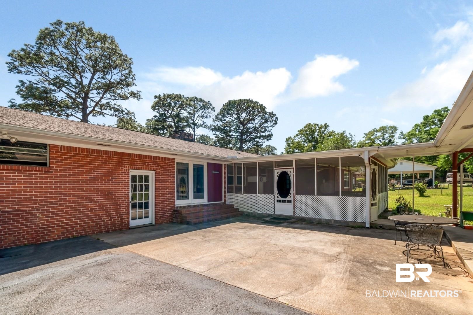 6300 Woodcrest Drive Mobile, AL 36608 - Photo 30 of 35 Rear view of property featuring a patio, brick siding, entry steps, and a sunroom