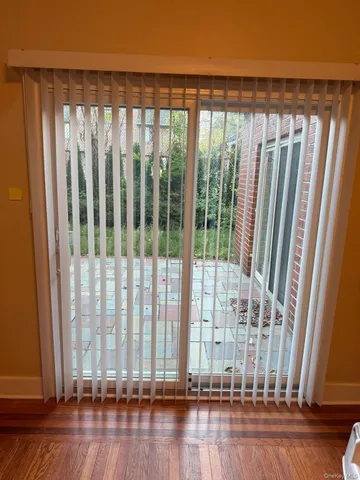 a view of wooden floor and bench in balcony