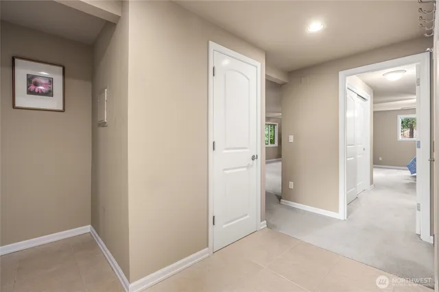 an empty room and a bathroom