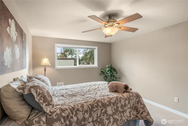 a view of bedroom with furniture and windows