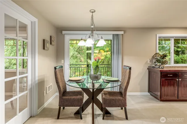 a view of a dining room with furniture window and outside view
