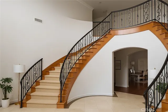 a view of entryway with wooden floor and a front door