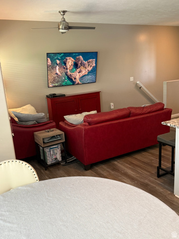 14797 South Chandlerpoint Way Draper, UT 84020 - Photo 5 of 33 Living area featuring wood-finish flooring, a contemporary ceiling fan with integrated lighting, and a neutral wall color