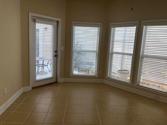 238 Abercorn Way Woodstock, GA 30188 - Photo 11 of 27 a view of an empty room with a window