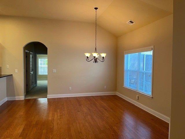 238 Abercorn Way Woodstock, GA 30188 - Photo 12 of 27 a view of room with window and wooden floor