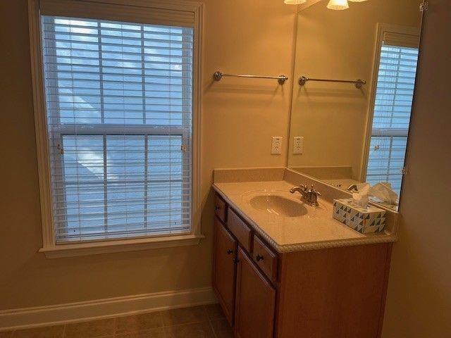 238 Abercorn Way Woodstock, GA 30188 - Photo 16 of 27 a bathroom with a sink and a shower