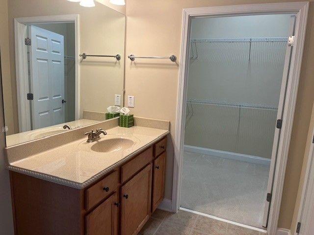 238 Abercorn Way Woodstock, GA 30188 - Photo 18 of 27 a bathroom with a sink and a mirror