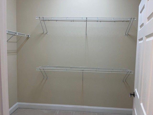 238 Abercorn Way Woodstock, GA 30188 - Photo 19 of 27 a view of a room with racks on the wall
