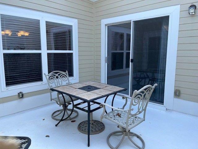 238 Abercorn Way Woodstock, GA 30188 - Photo 20 of 27 a table and chairs in patio