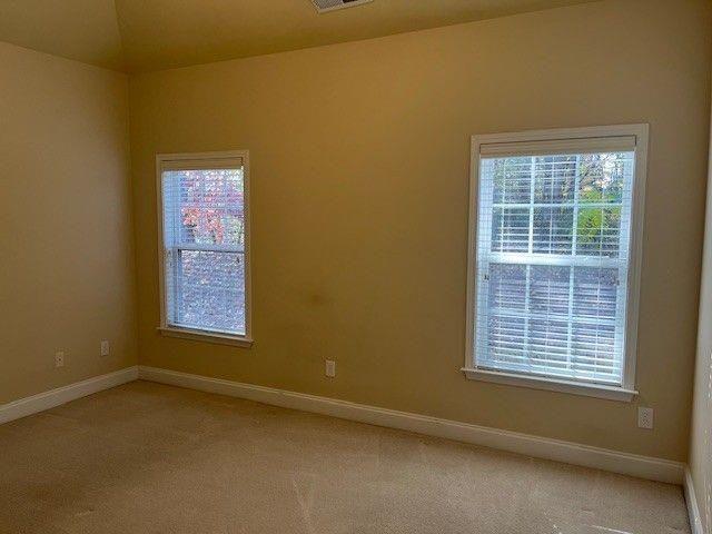 238 Abercorn Way Woodstock, GA 30188 - Photo 22 of 27 a view of an empty room with a window
