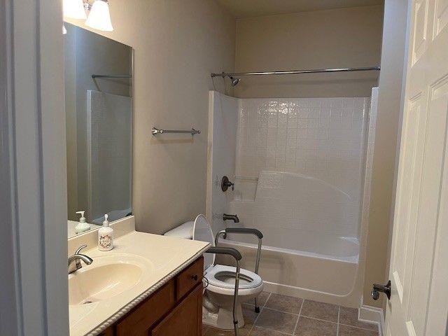 238 Abercorn Way Woodstock, GA 30188 - Photo 23 of 27 a bathroom with a bathtub shower sink vanity and toilet
