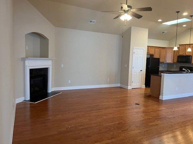 238 Abercorn Way Woodstock, GA 30188 - Photo 6 of 27 a view of a kitchen with a stove cabinets and wooden floor
