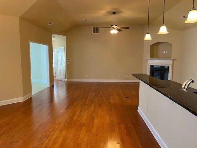238 Abercorn Way Woodstock, GA 30188 - Photo 8 of 27 a view of a kitchen with wooden floor and a ceiling fan