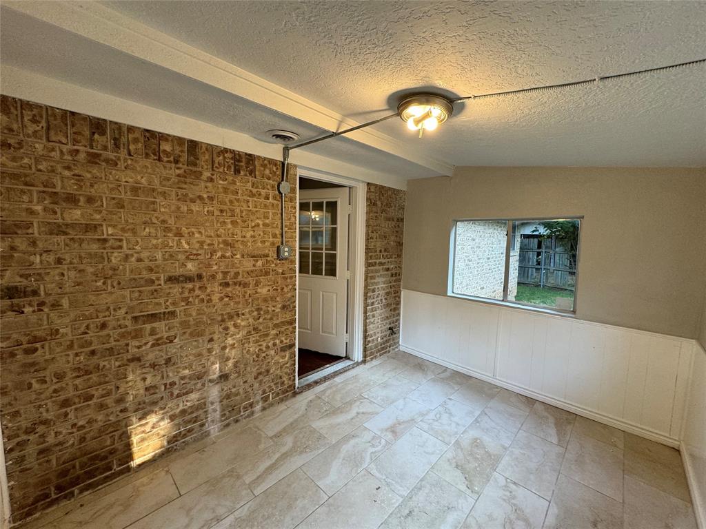 2004 Throckmorton Street Gainesville, TX 76240 - Photo 16 of 24 a view of an empty room with a window