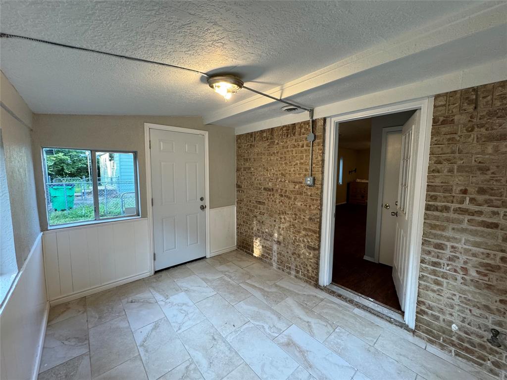 2004 Throckmorton Street Gainesville, TX 76240 - Photo 17 of 24 an empty room with windows