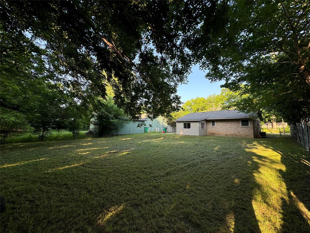 2004 Throckmorton Street Gainesville, TX 76240 - Photo 4 of 24 a view of a house with a yard
