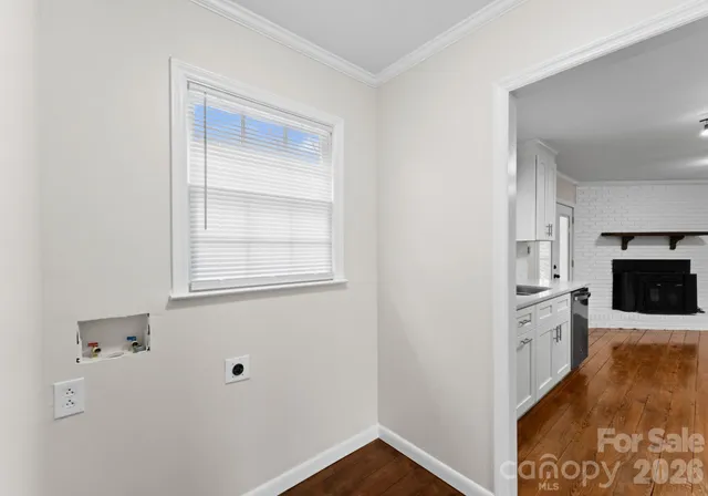 a kitchen with sink cabinets and stainless steel appliances