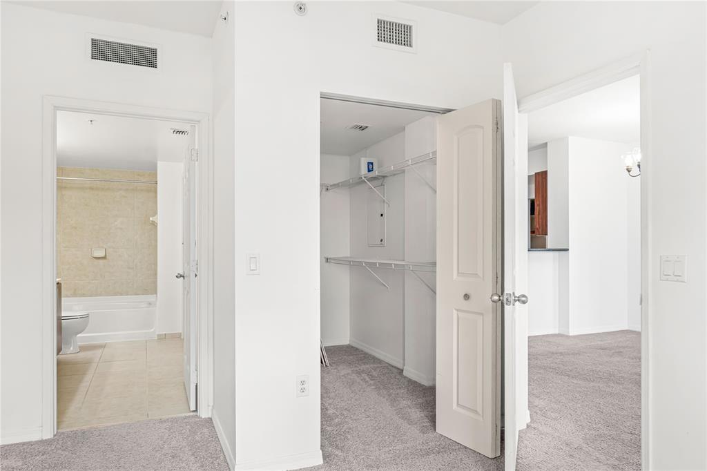 2421 Northeast 65th Street, Unit 318 Fort Lauderdale, FL 33308 - Photo 12 of 31 a view of a bathroom with a shower and a sink
