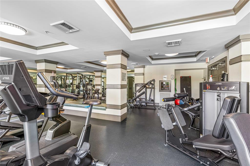 2421 Northeast 65th Street, Unit 318 Fort Lauderdale, FL 33308 - Photo 24 of 31 a view of a room with gym equipment