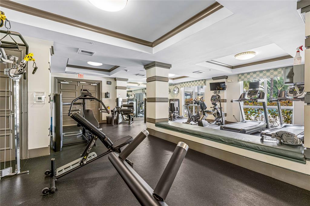 2421 Northeast 65th Street, Unit 318 Fort Lauderdale, FL 33308 - Photo 26 of 31 a view of a room with gym equipment