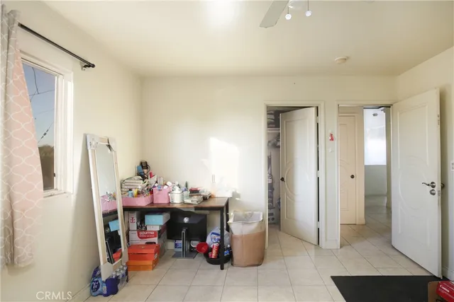 a bedroom with furniture and a window