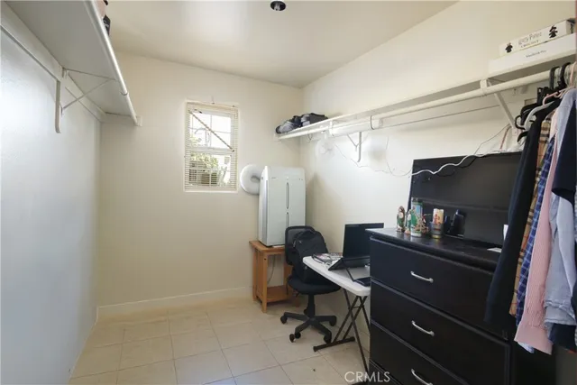 a room that has a dresser and a chair in it
