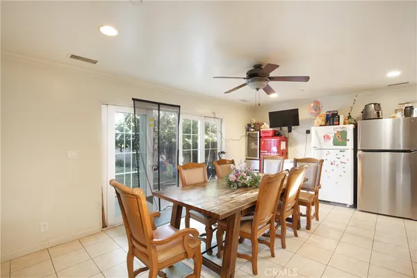a dining room with furniture and a chandelier