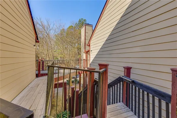 a view of balcony and wooden floor