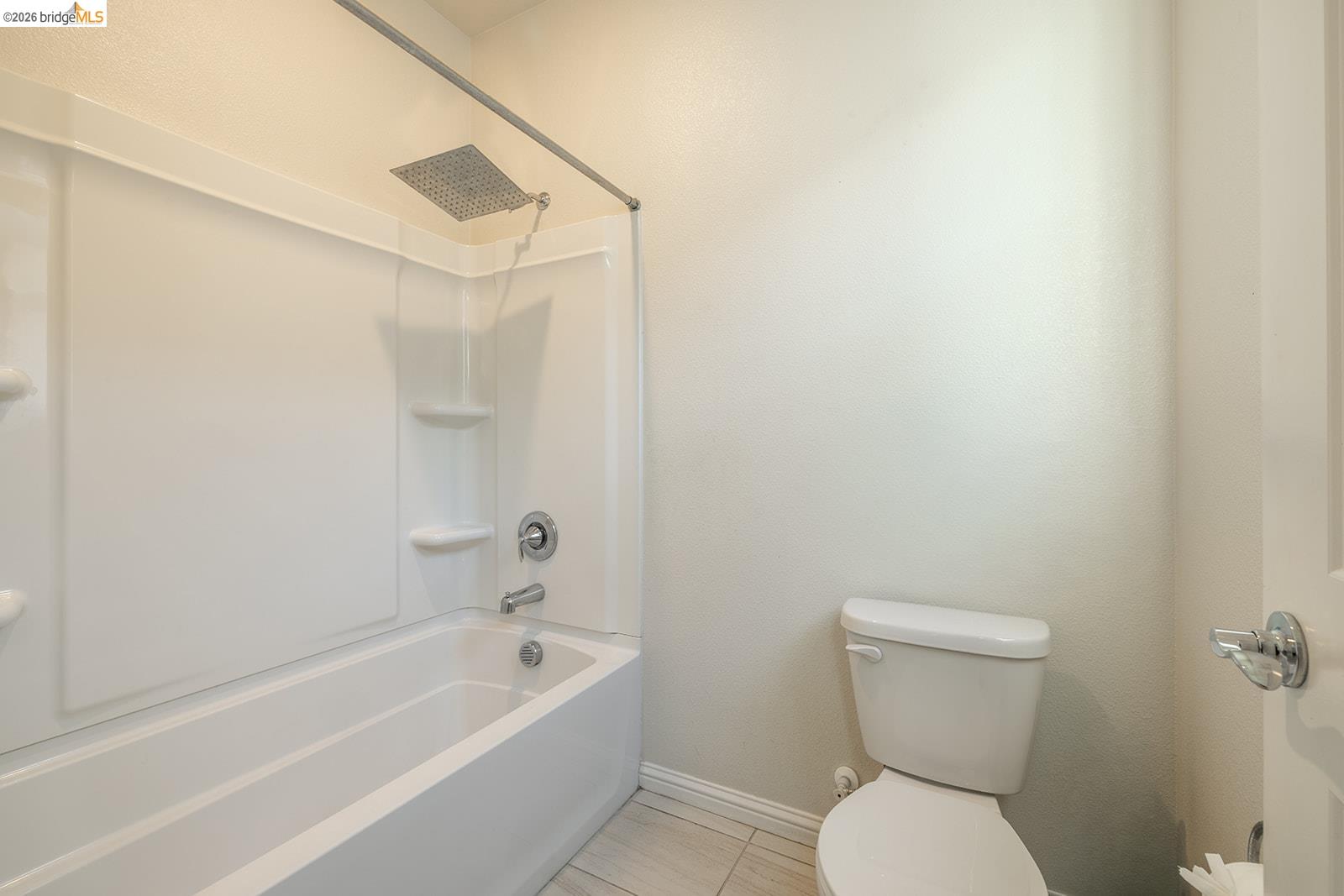 974 Princess Way Brentwood, CA 94513 - Photo 36 of 49 Bathroom featuring a white tub-shower combination with a rain showerhead, chrome fixtures, and integrated shelving