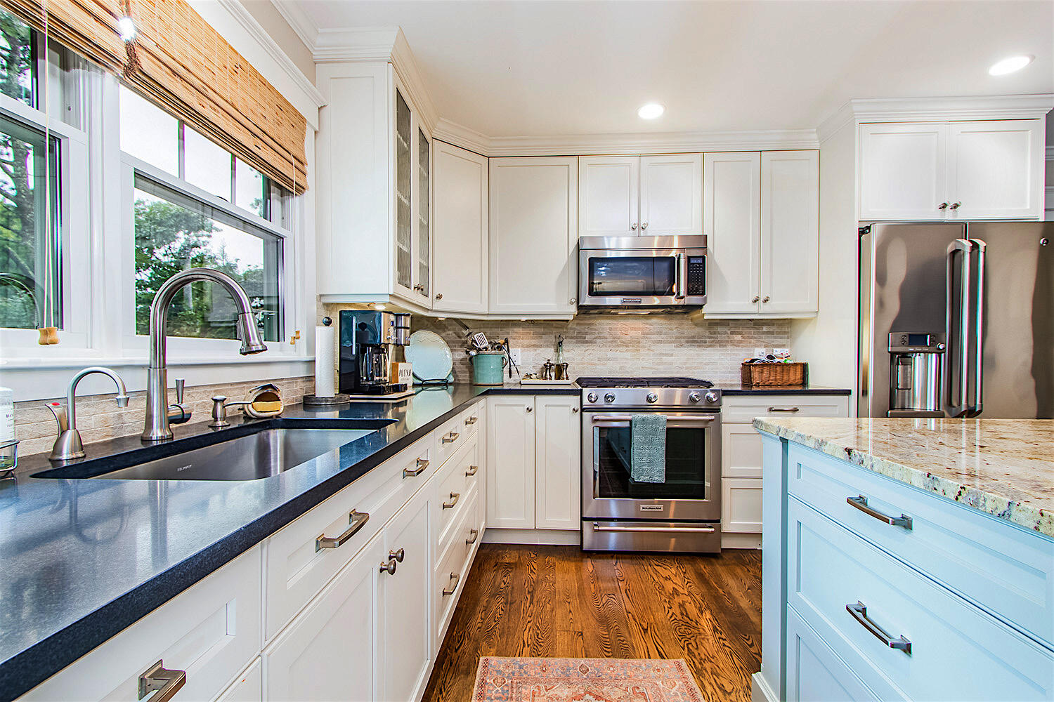 346 Holly Point Road Centerville, MA 02632 - Photo 12 of 52 a kitchen with stainless steel appliances granite countertop a stove a sink and a refrigerator