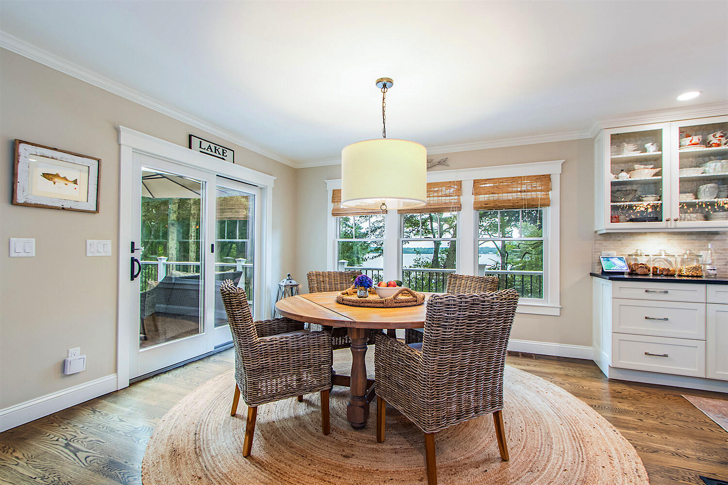 346 Holly Point Road Centerville, MA 02632 - Photo 16 of 52 a dining room with furniture a chandelier and wooden floor