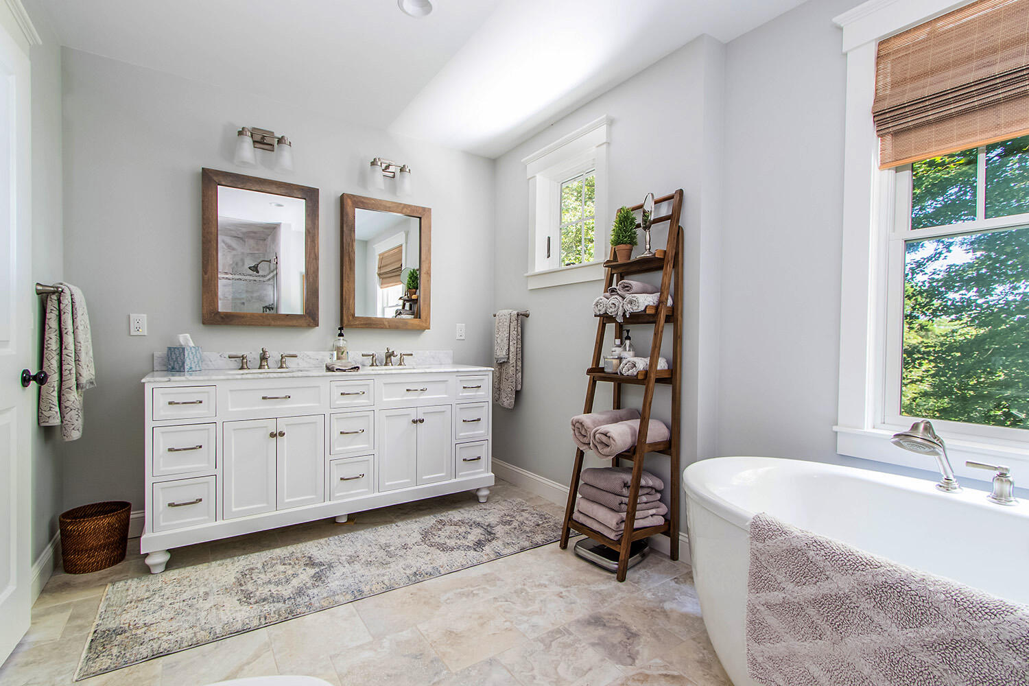 346 Holly Point Road Centerville, MA 02632 - Photo 21 of 52 a spacious bathroom with a double vanity sink and a bathtub