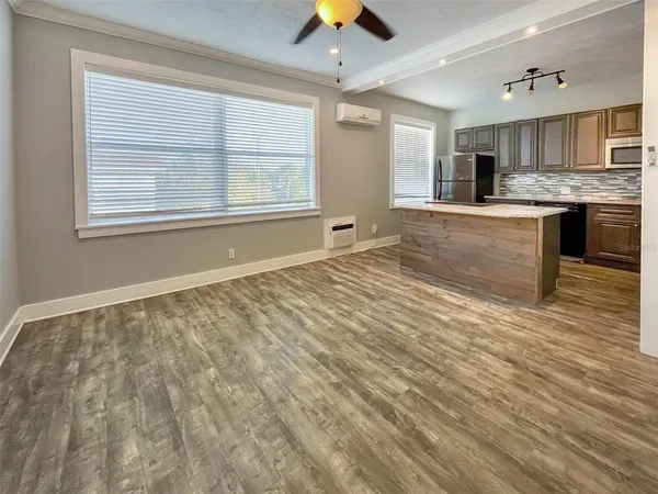a view of kitchen with granite countertop cabinets and outdoor space