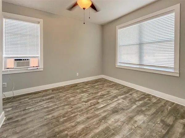 a view of an empty room with a window