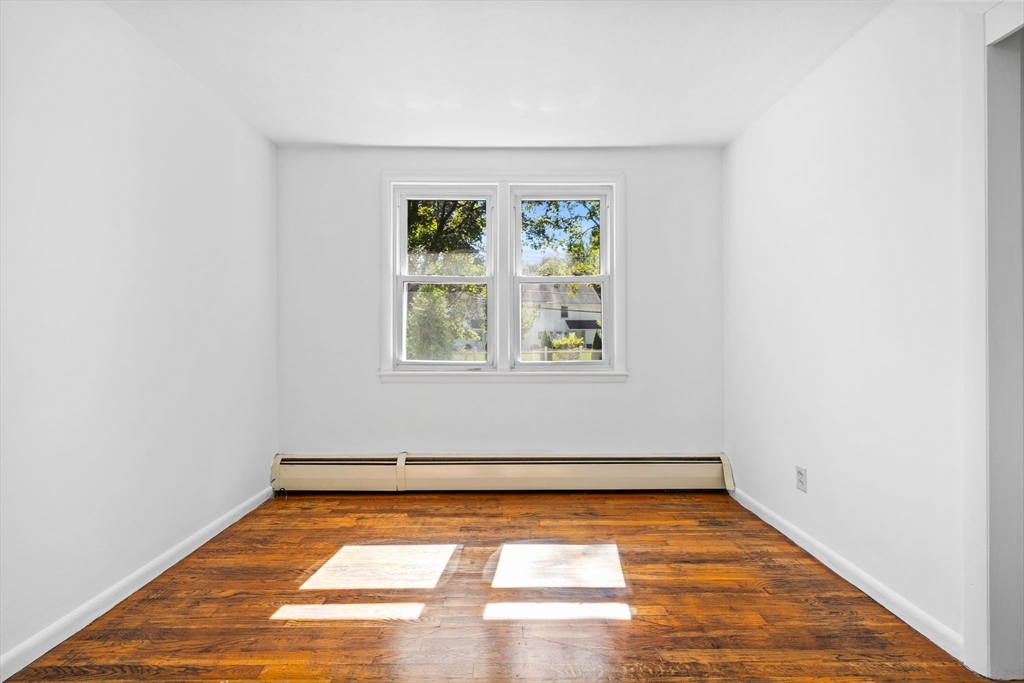 18 Pullard Road Grafton, MA 01519 - Photo 12 of 28 a view of room with window and wooden floor