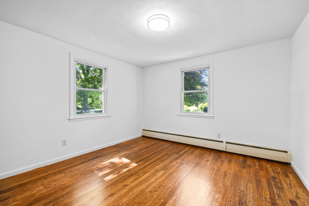 18 Pullard Road Grafton, MA 01519 - Photo 14 of 28 wooden floor in an empty room with a window