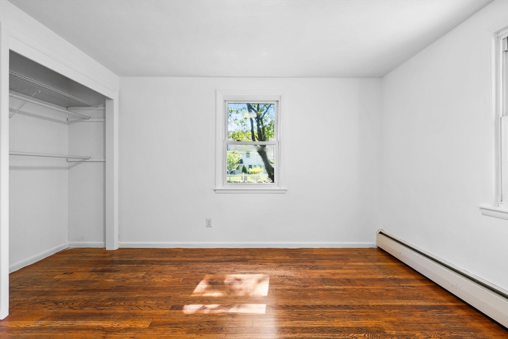 18 Pullard Road Grafton, MA 01519 - Photo 15 of 28 a view of an empty room with wooden floor and a window