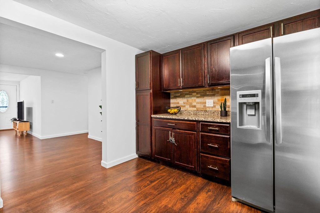 18 Pullard Road Grafton, MA 01519 - Photo 9 of 28 a kitchen with granite countertop wooden cabinets and stainless steel appliances