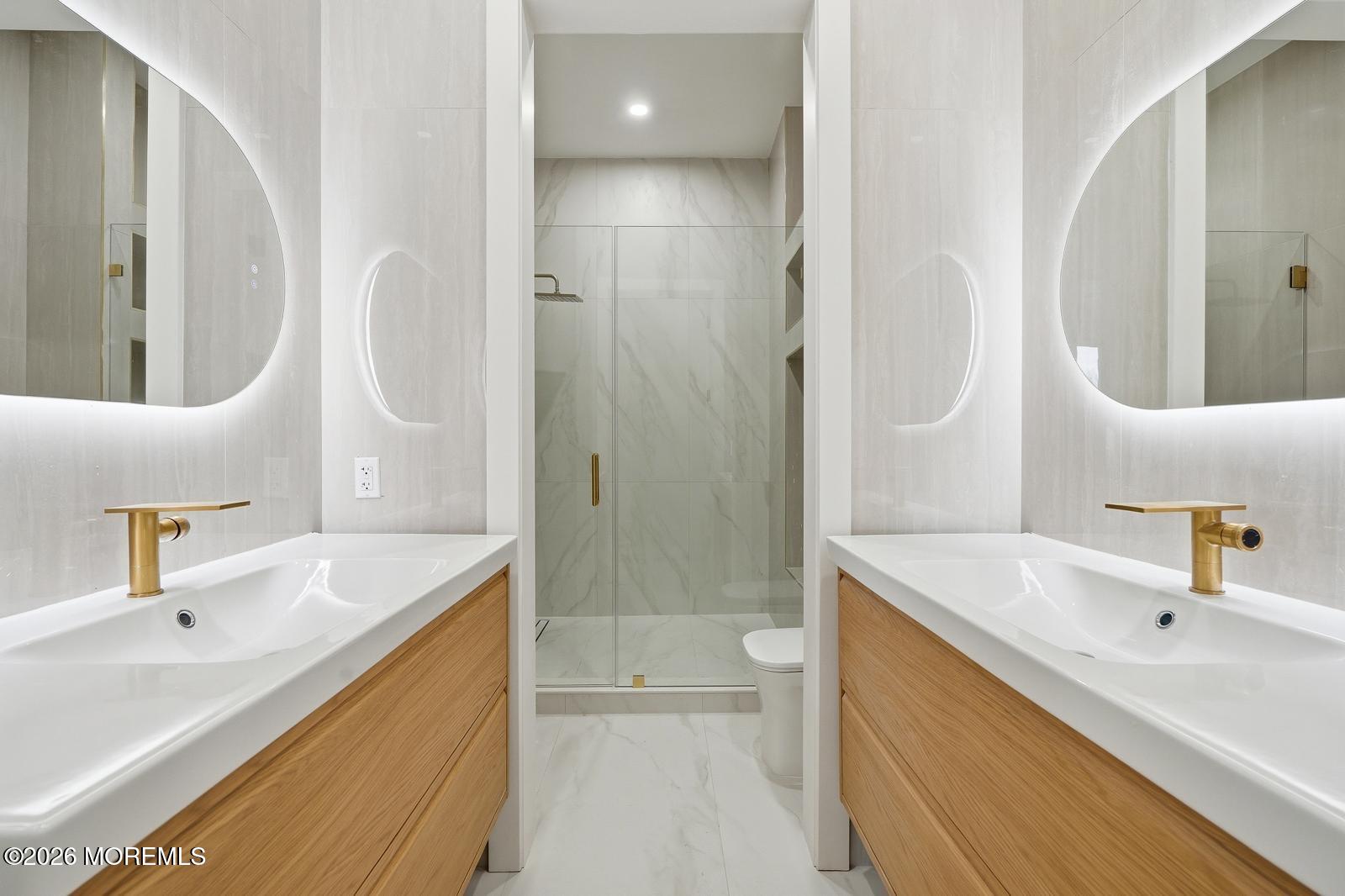 152 Ampere Avenue Oakhurst, NJ 07755 - Photo 12 of 18 a bathroom with a sink a toilet and shower