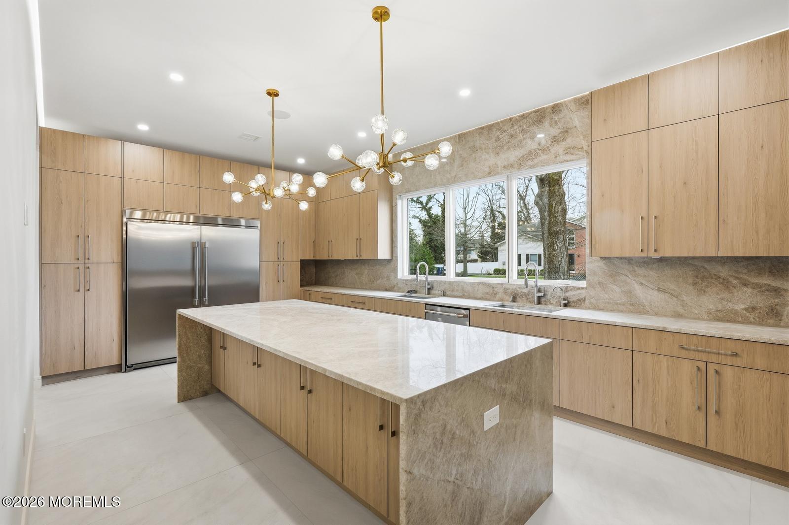 152 Ampere Avenue Oakhurst, NJ 07755 - Photo 4 of 18 a large kitchen with kitchen island a sink stainless steel appliances and a chandelier