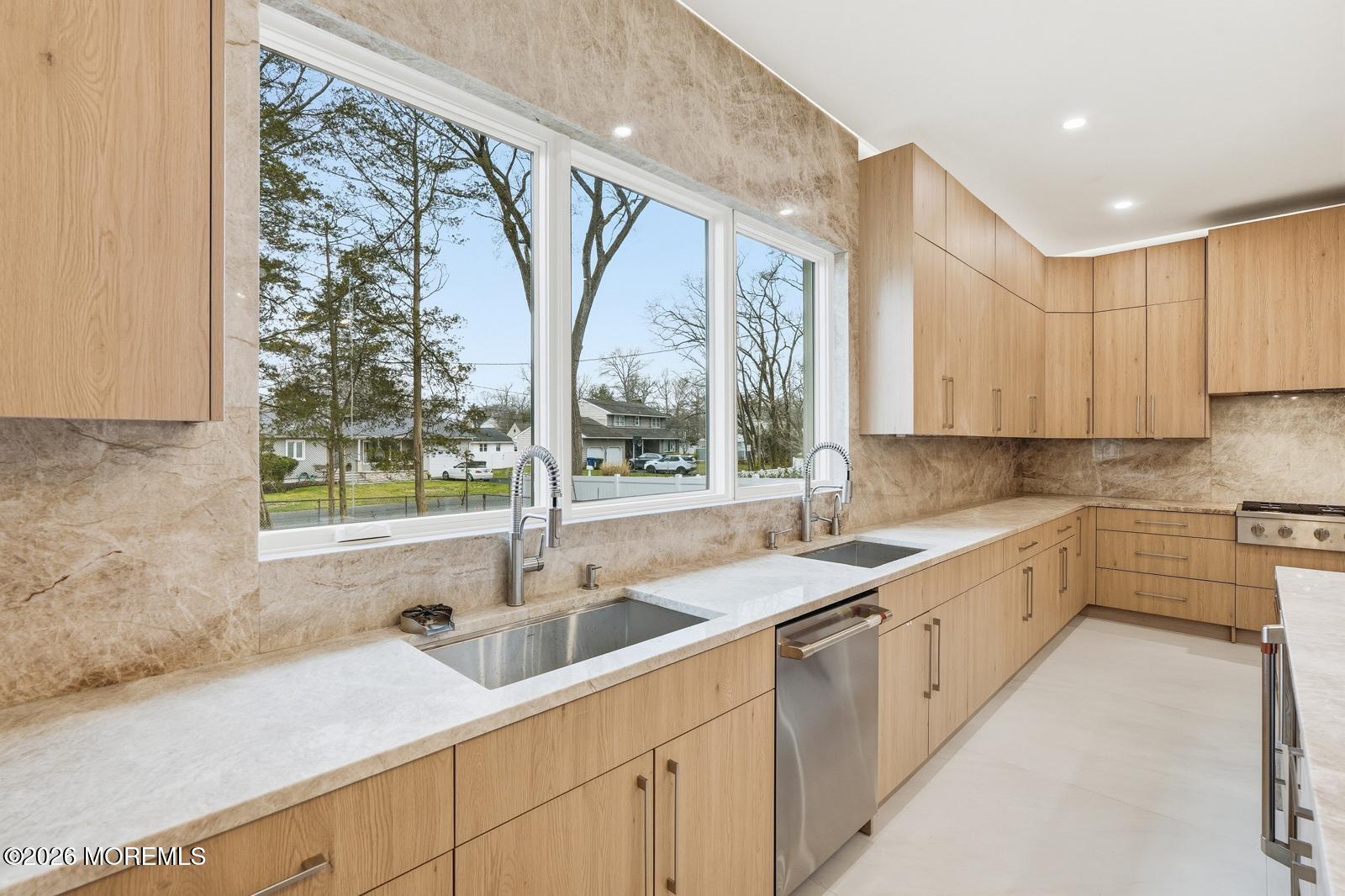 152 Ampere Avenue Oakhurst, NJ 07755 - Photo 5 of 18 a kitchen with a sink window and cabinets