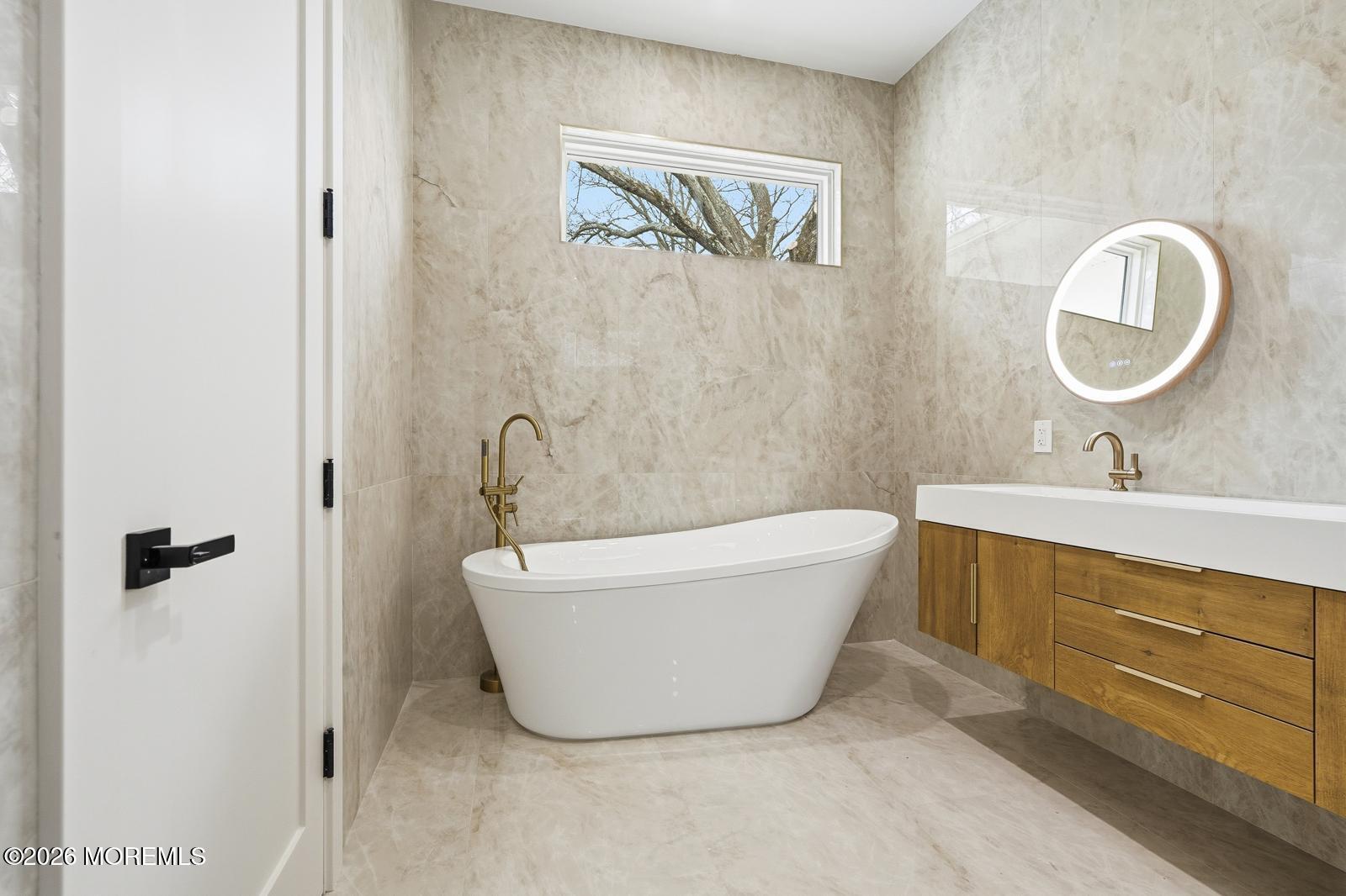 152 Ampere Avenue Oakhurst, NJ 07755 - Photo 8 of 18 a bathroom with a bathtub and a sink