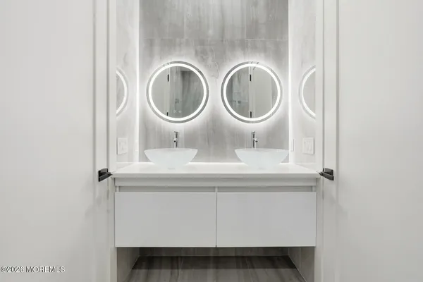 a bathroom with a sink and a mirror