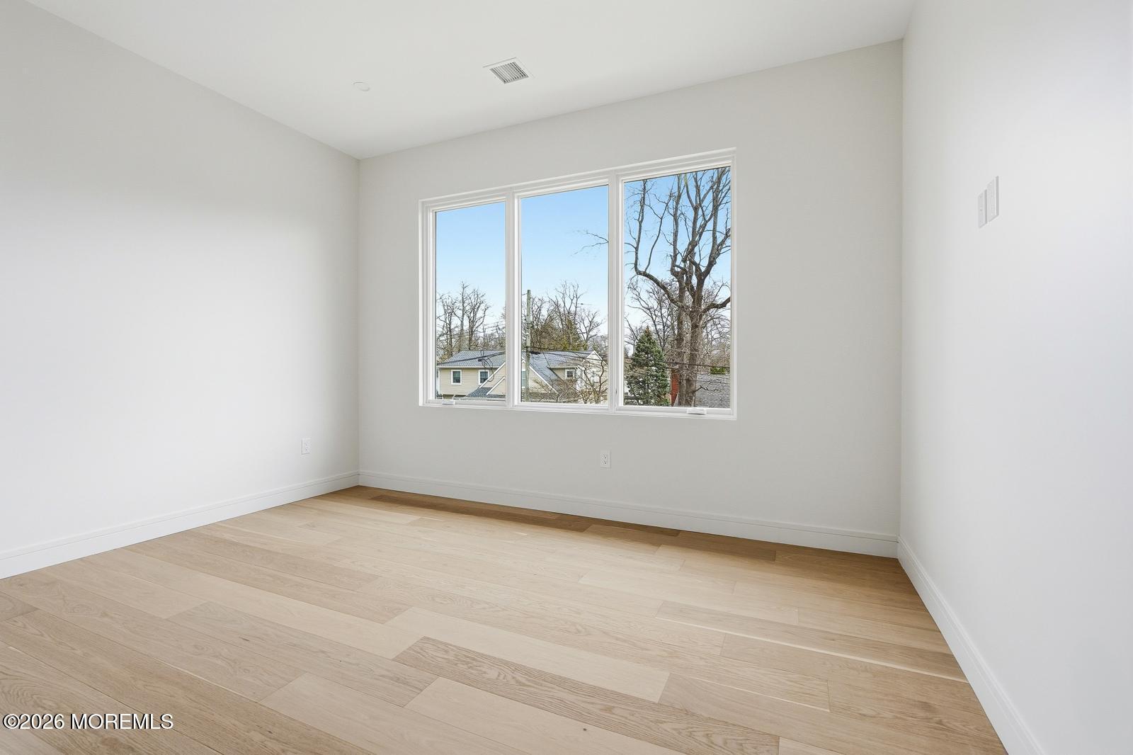 152 Ampere Avenue Oakhurst, NJ 07755 - Photo 10 of 18 an empty room with windows