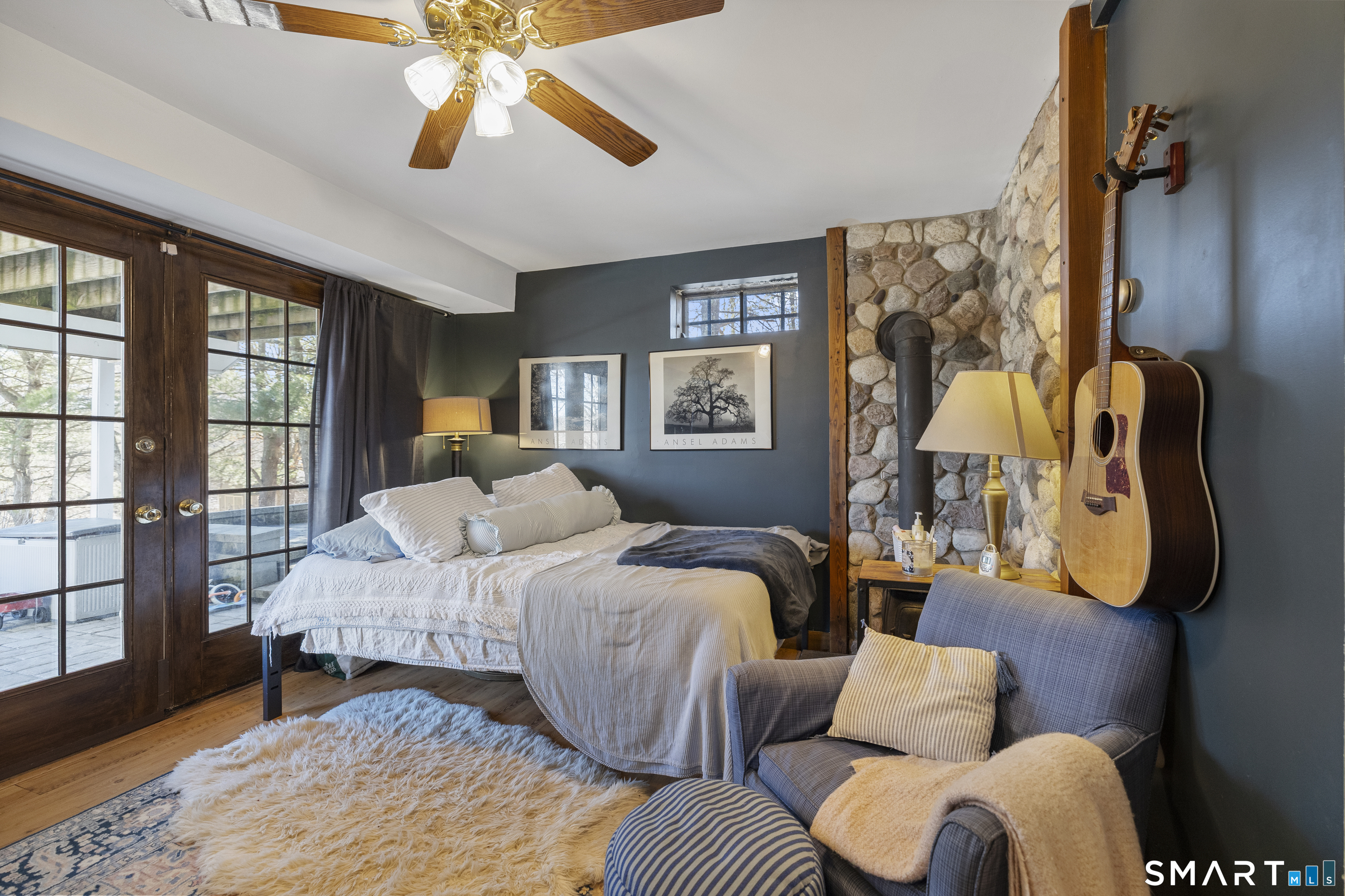 105 Bldg Brook Road Hamden, CT 06514 - Photo 26 of 39 Finished room in basement, French doors to patio.