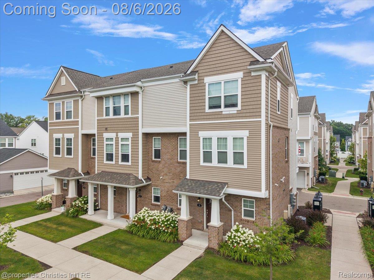 2500 Normandy Road, Unit 38 Royal Oak, MI 48073 - Photo 41 of 55 Contemporary townhome exterior featuring a combination of brick and horizontal siding