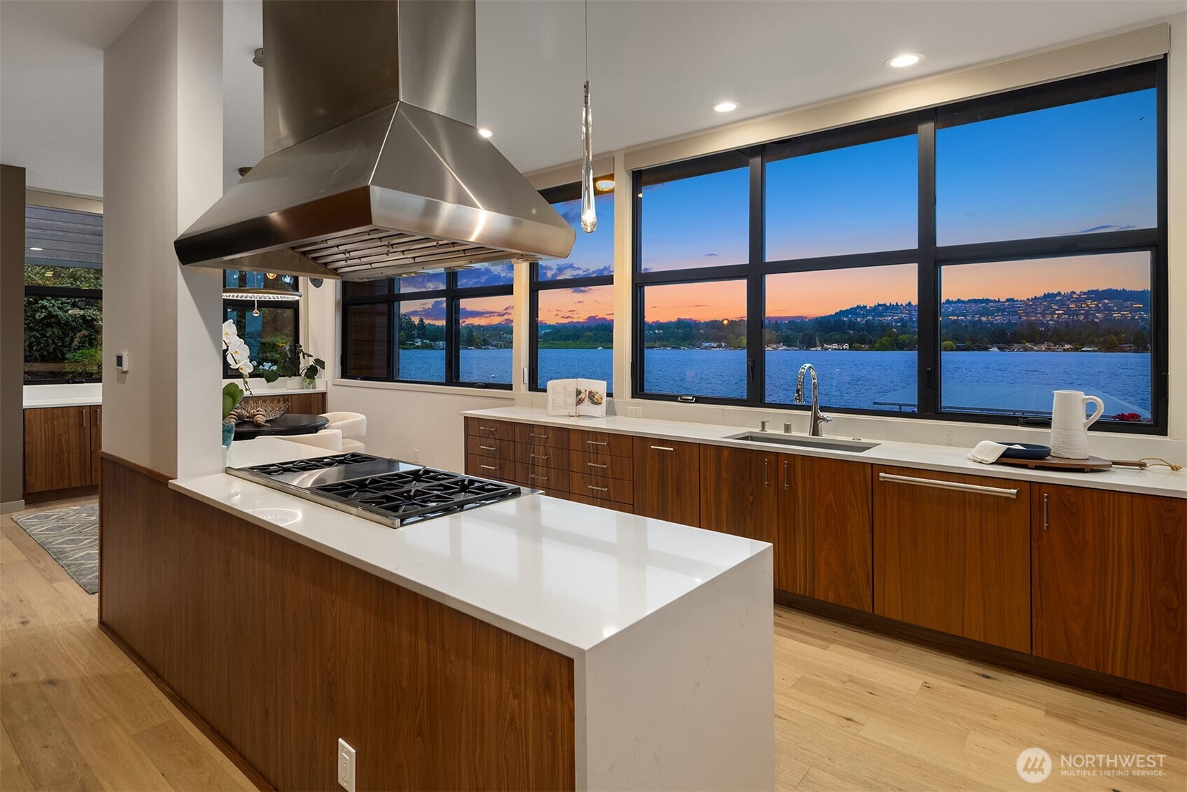 3840 East Mercer Way Mercer Island, WA 98040 - Photo 12 of 40 a kitchen with stainless steel appliances a sink a stove and a wooden floors