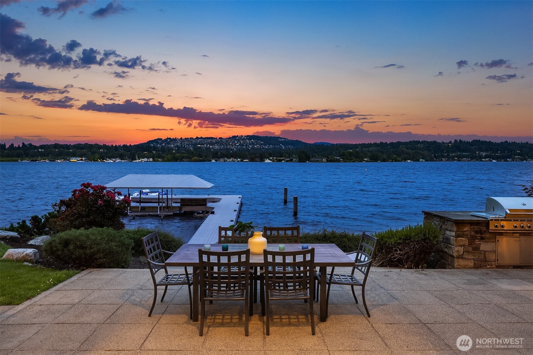 3840 East Mercer Way Mercer Island, WA 98040 - Photo 34 of 40 a view of a patio with a table and chairs under an umbrella