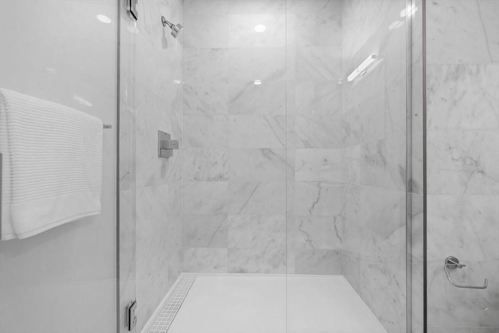 301 Border Street, Unit 409 Boston, MA 02128 - Photo 13 of 23 a bathroom with a shower
