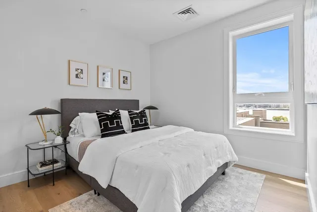 a bedroom with bed and a window